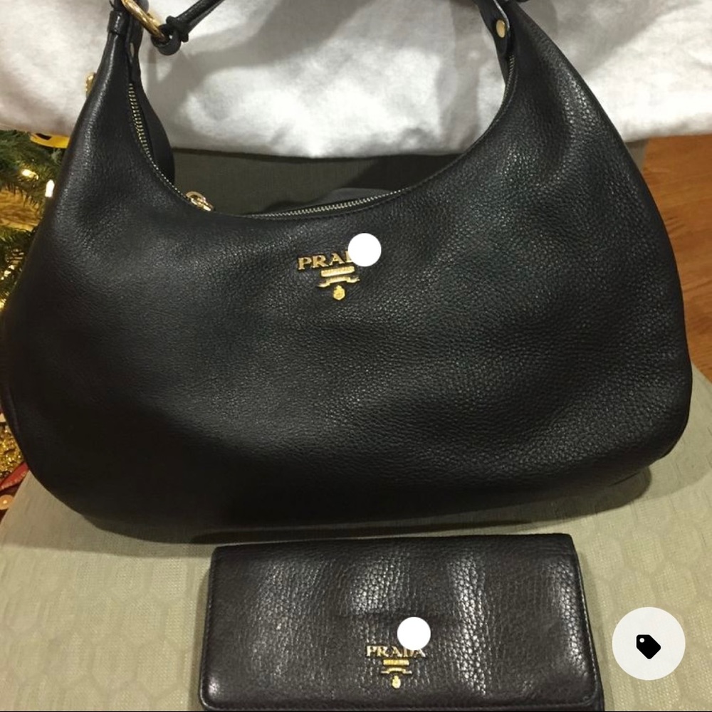 Pre-owned Prada Hobo bag with gold hardware with prestige condition.